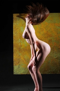 Gorgeous brunette posing in darkroom