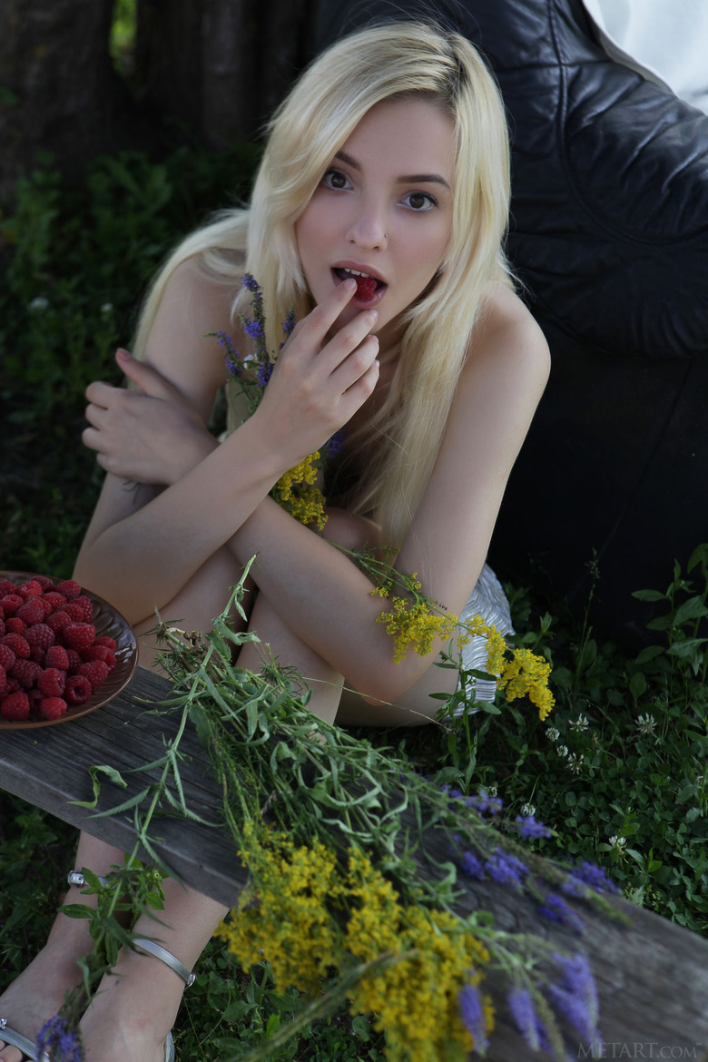  she devours a succulent raspberry between her luscious lips