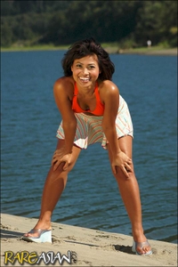 Cute asian babe in orange 
